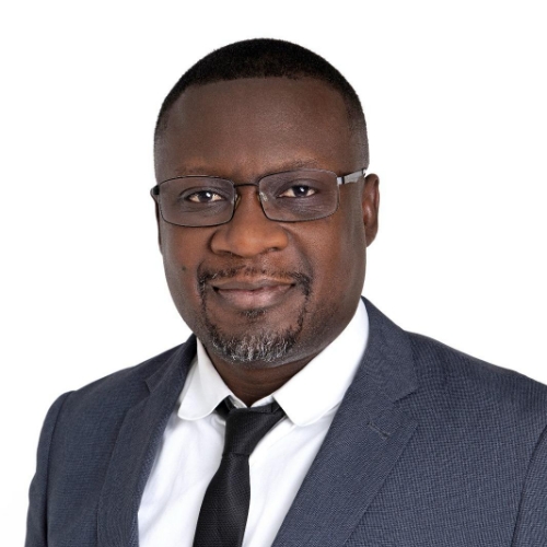 Alfred Asenso - Business Manager, ensuring smooth operations at Fresh Springs Care. Alfred Asenso, Business Manager at Fresh Springs Care, standing outdoors with a smile.